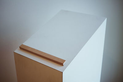 High angle view of table against white wall