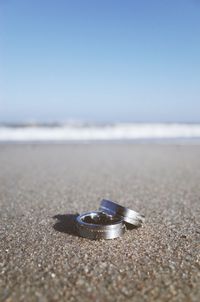 Close-up of rings on beach