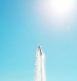 High section of built structure against clear blue sky