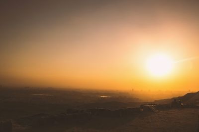 Scenic view of landscape against sky during sunset