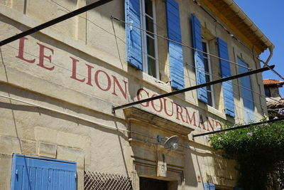 Low angle view of text on building