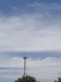 Low angle view of electricity pylon against sky