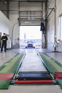 Car entering in auto repair shop