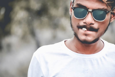 Portrait of young man wearing sunglasses