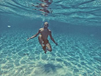 Man swimming in sea