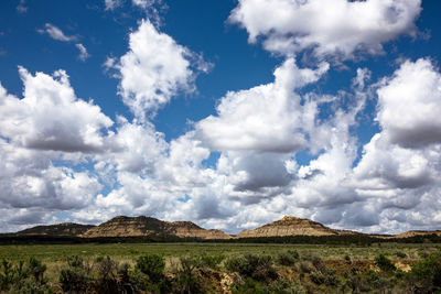 Scenic view of mountains against cloudy sky