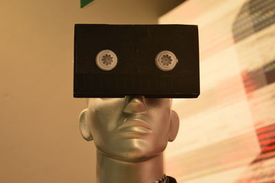 Close-up of audio cassette with mannequin