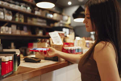 Young woman drinking coffee