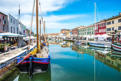 Boats moored at harbor