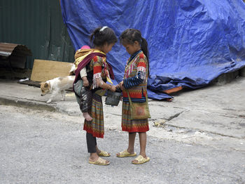 Rear view of women with dog