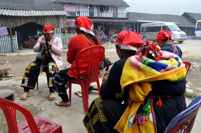 Men sitting in traditional clothing