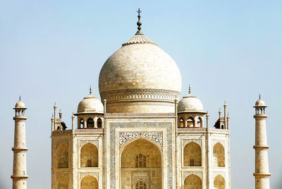 Low angle view of taj mahal against clear sky on sunny day