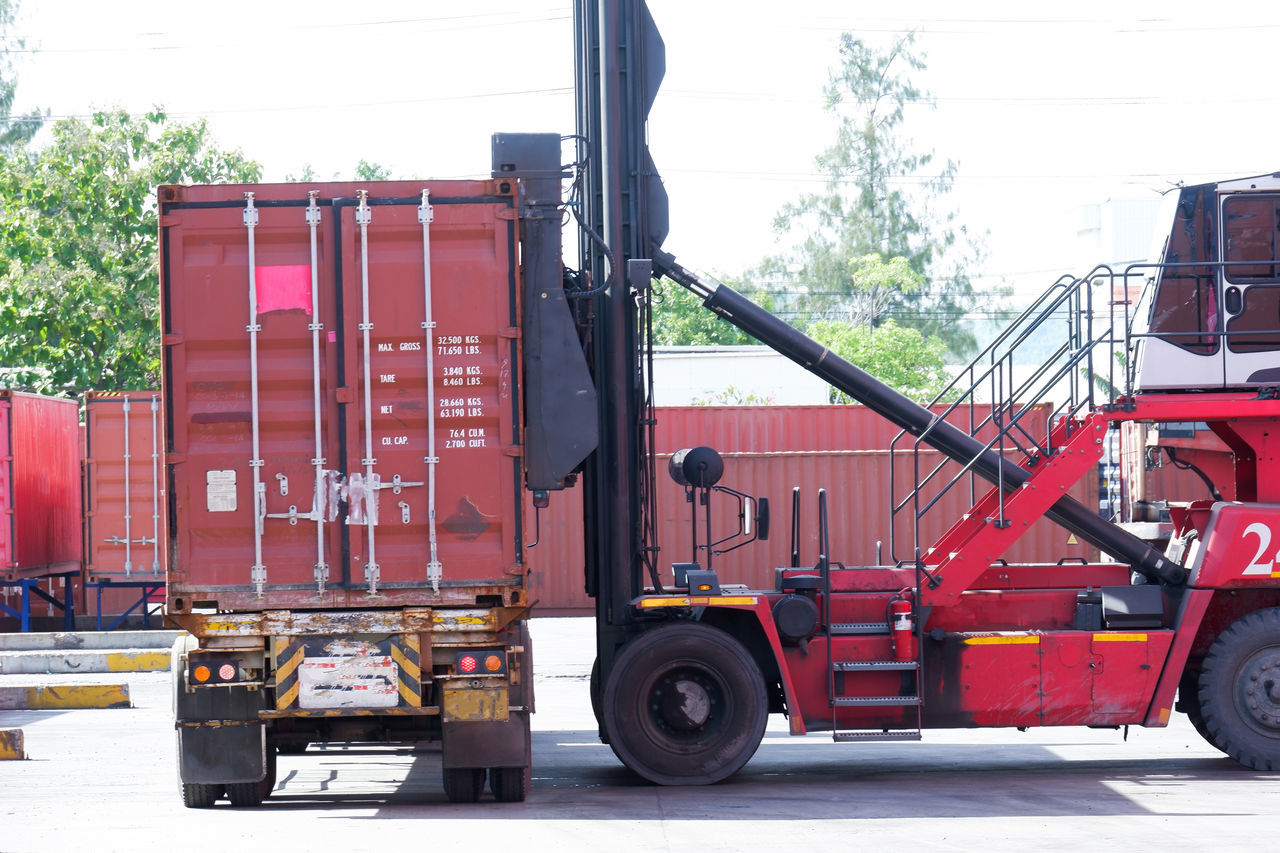 STACK OF RED TRUCK ON ROAD