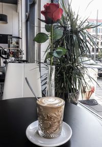 Close-up of coffee served on table in cafe