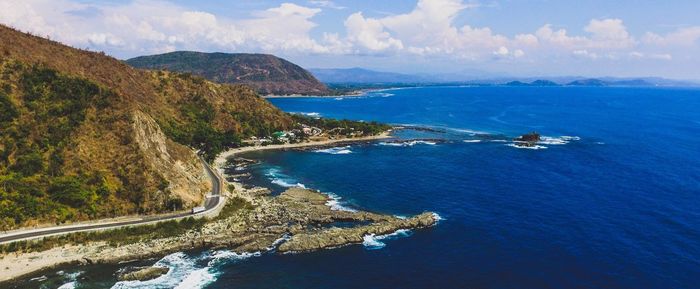 High angle view of road by sea against sky