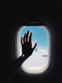 Man looking through airplane window