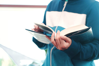 Close-up of woman hand holding book