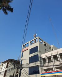 Low angle view of building against blue sky