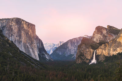 Scenic view of rocky mountains against sky during sunset