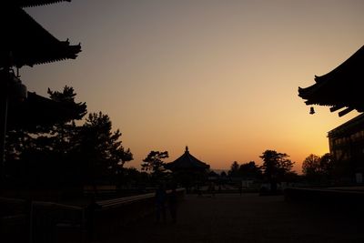 Silhouette of city at sunset