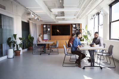 Business colleagues working at desks in office