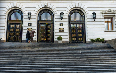 People standing at entrance of building