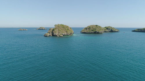 Aerial view of small islands with beaches and lagoons in hundred islands national park