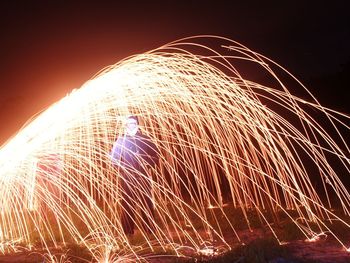 Light trails against sky at night