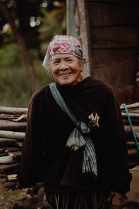 Portrait of young woman standing outdoors