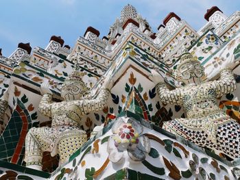 Low angle view of statue against sky