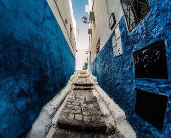 Narrow alley amidst buildings in city