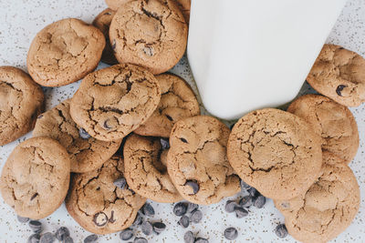 Close-up of cookies with milk on table