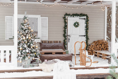 The porch of a country house decorated for christmas and new year holidays. christmas tree 