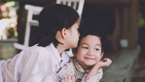 Portrait of mother and daughter outdoors