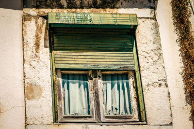 Low angle view of window on old building