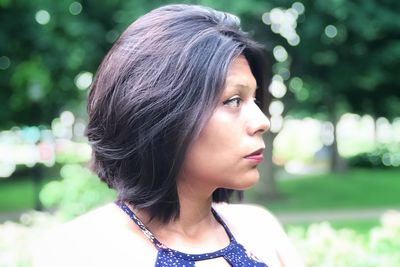 Portrait of a beautiful young woman looking away