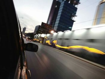 Blurred motion of car on road in city