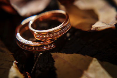 Close-up of wedding rings on table