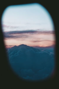 Scenic view of cloudscape seen through window