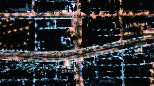 Reflection of illuminated building in water at night