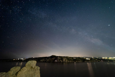 Scenic view of sea against sky at night