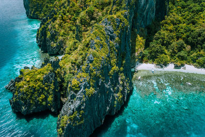 High angle view of rocks by sea