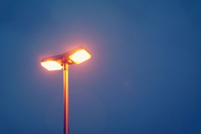 Low angle view of illuminated street light