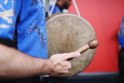 Close-up of man playing musical instrument