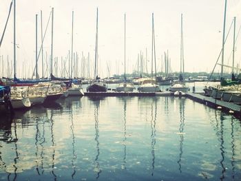 Boats moored at harbor