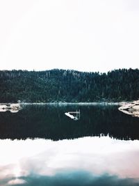 Scenic view of calm lake against clear sky