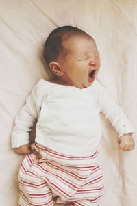 Cute baby sleeping on bed