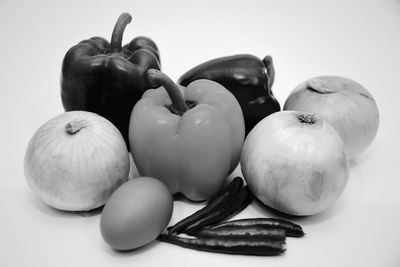 Close-up of fruits on table against white background