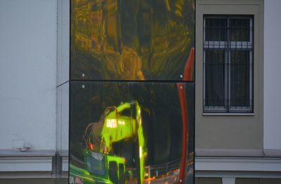 Reflection of building on glass window