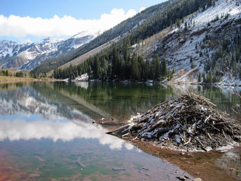 Scenic view of lake and mountains against sky